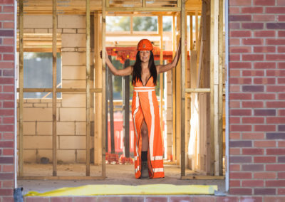 Kelly Cartwright - Core Recruiter - in a bright orange and reflective Hi Viz Dress